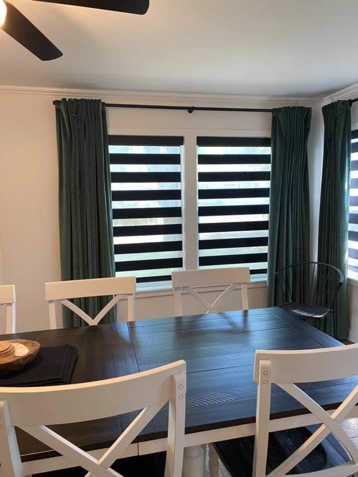Room with striped blinds covered by warranty for quality protection.